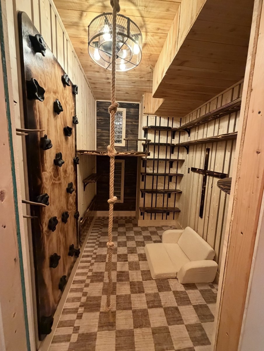 After - finished playroom with climbing wall and woodwork