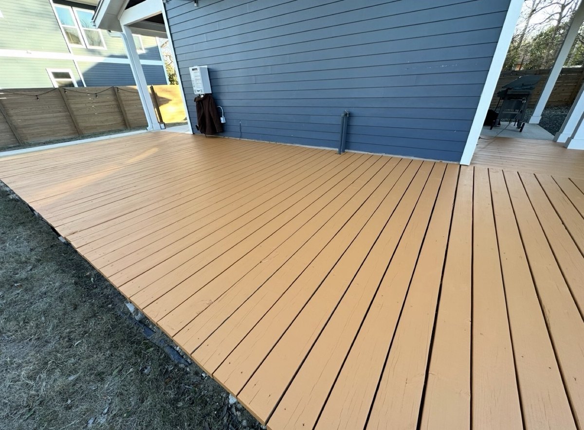After - wooden deck freshly stained golden tan finish