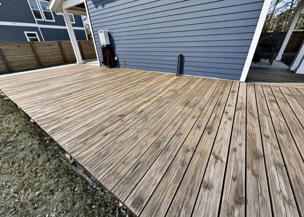 Before - weathered gray wooden deck before staining