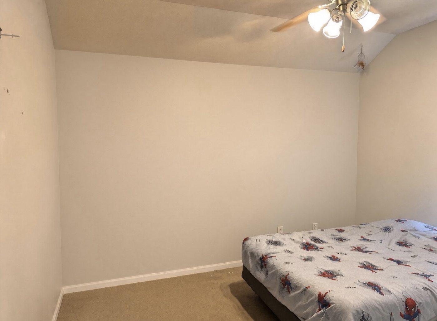 Before - plain white bedroom wall before two-tone paint design